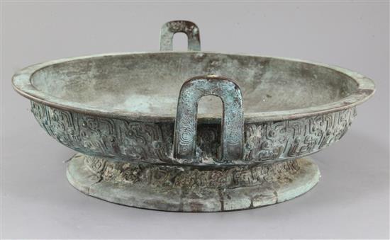 A Chinese archaic bronze ritual water basin, Pan, early Eastern Zhou dynasty, 8th-7th century B.C., 15cm high, 40.5cm, old repairs